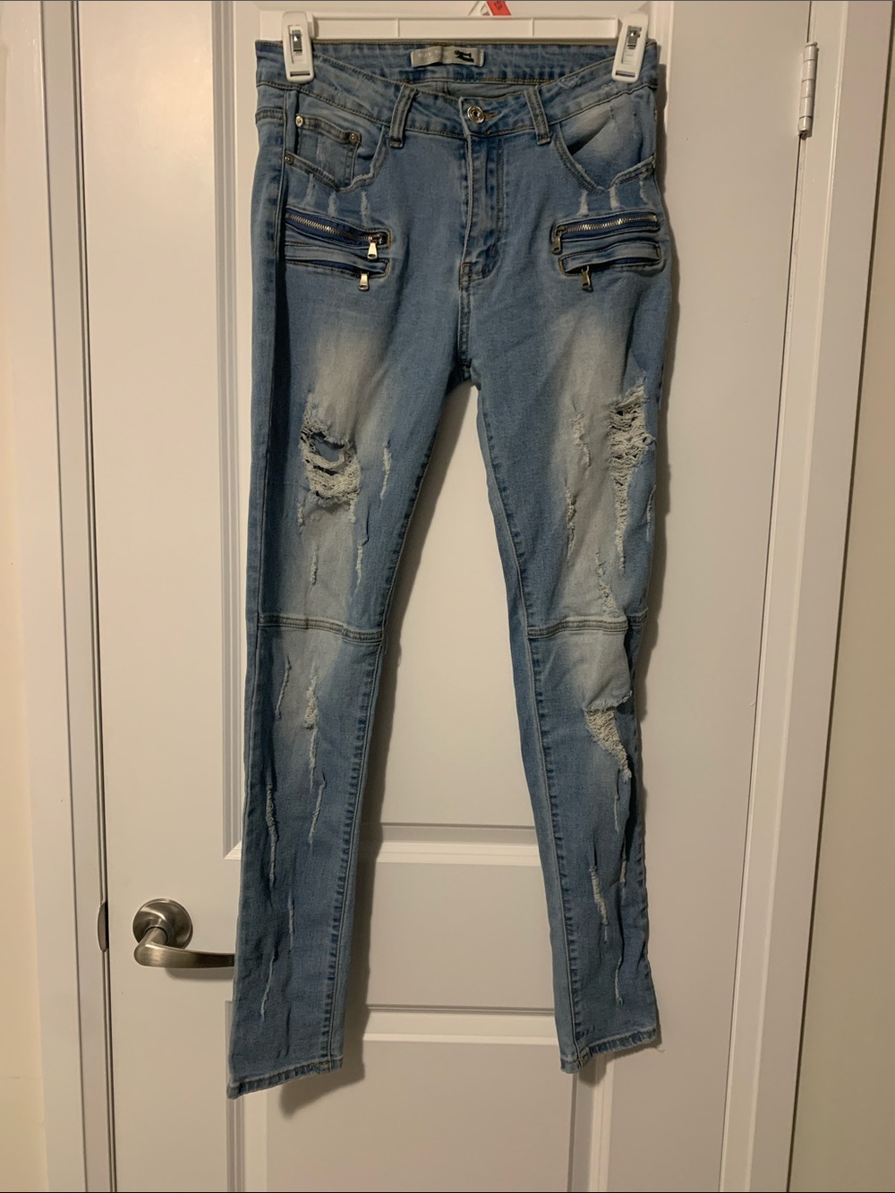 Women's Light Blue Distressed Skinny Jeans with Zip Pocket Detail